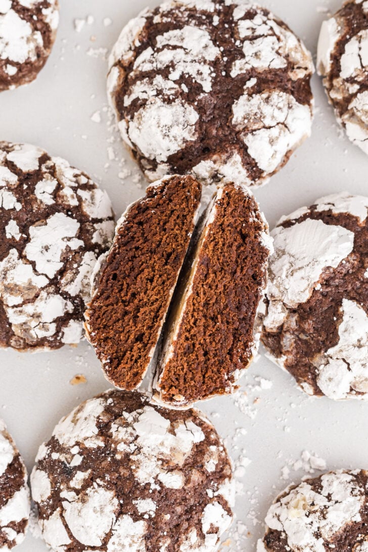 Crinkle cookie cut in half showing its delicious chocolate center.