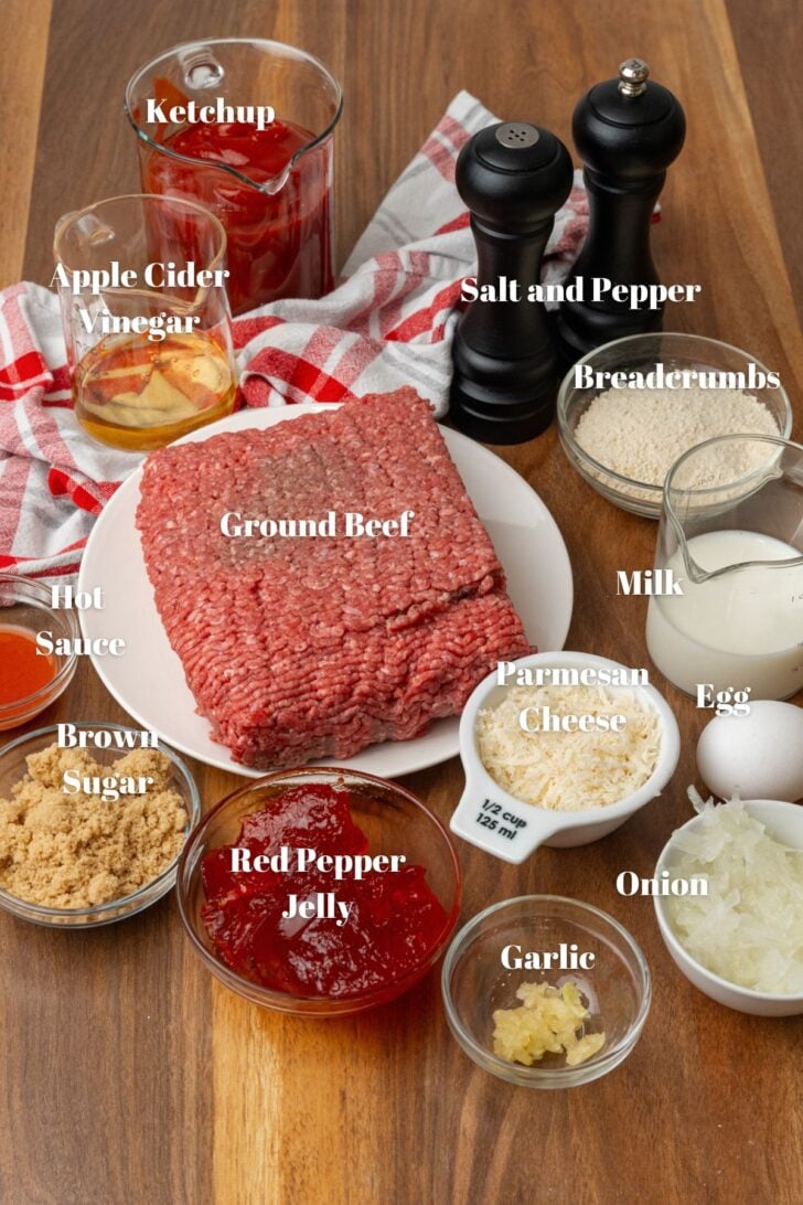 Ground beef, ketchup, apple cider vinegar, milk, breadcrumbs, egg, onion, Parmesan cheese, garlic, red pepper jelly, brown sugar, hot sauce in glass containers.