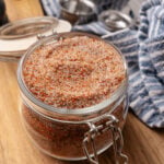 House seasoning blend in a small mason jar on top of a cutting board.