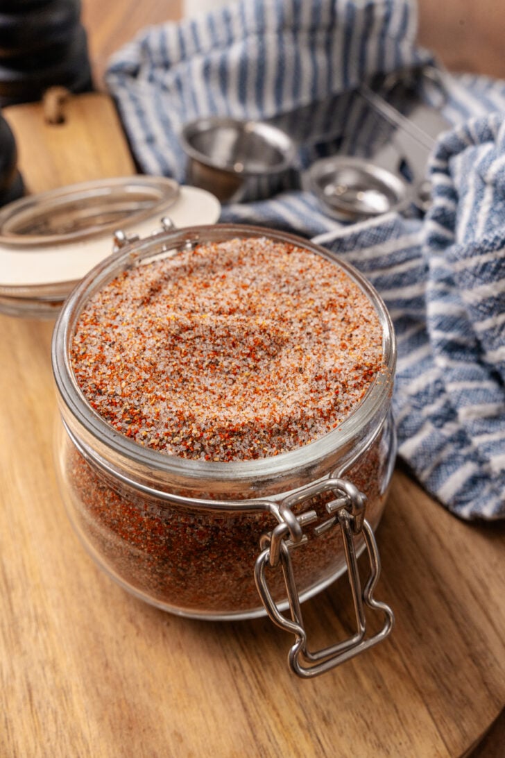 House seasoning blend in a small mason jar on top of a cutting board.