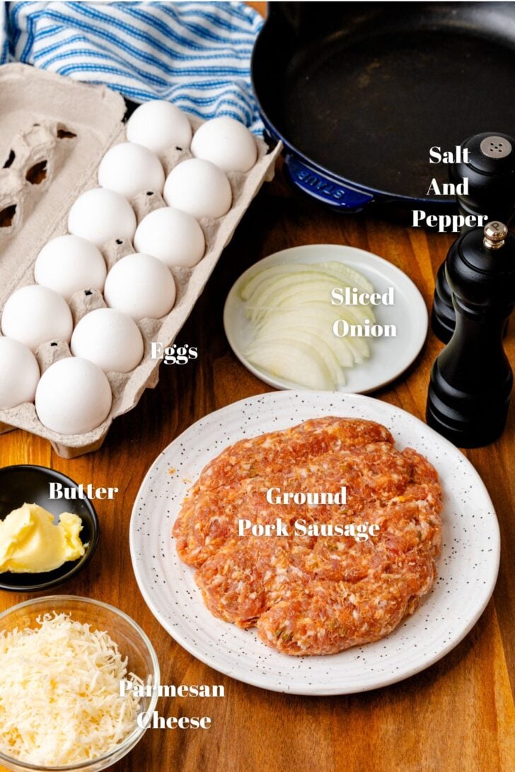 Ingredients to make a delicious gluten free frittata. Sausage, eggs, butter, parmesan cheese, onions and salt and pepper.