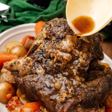 Overhead shot of the Irish pot roast in a white serving dish.