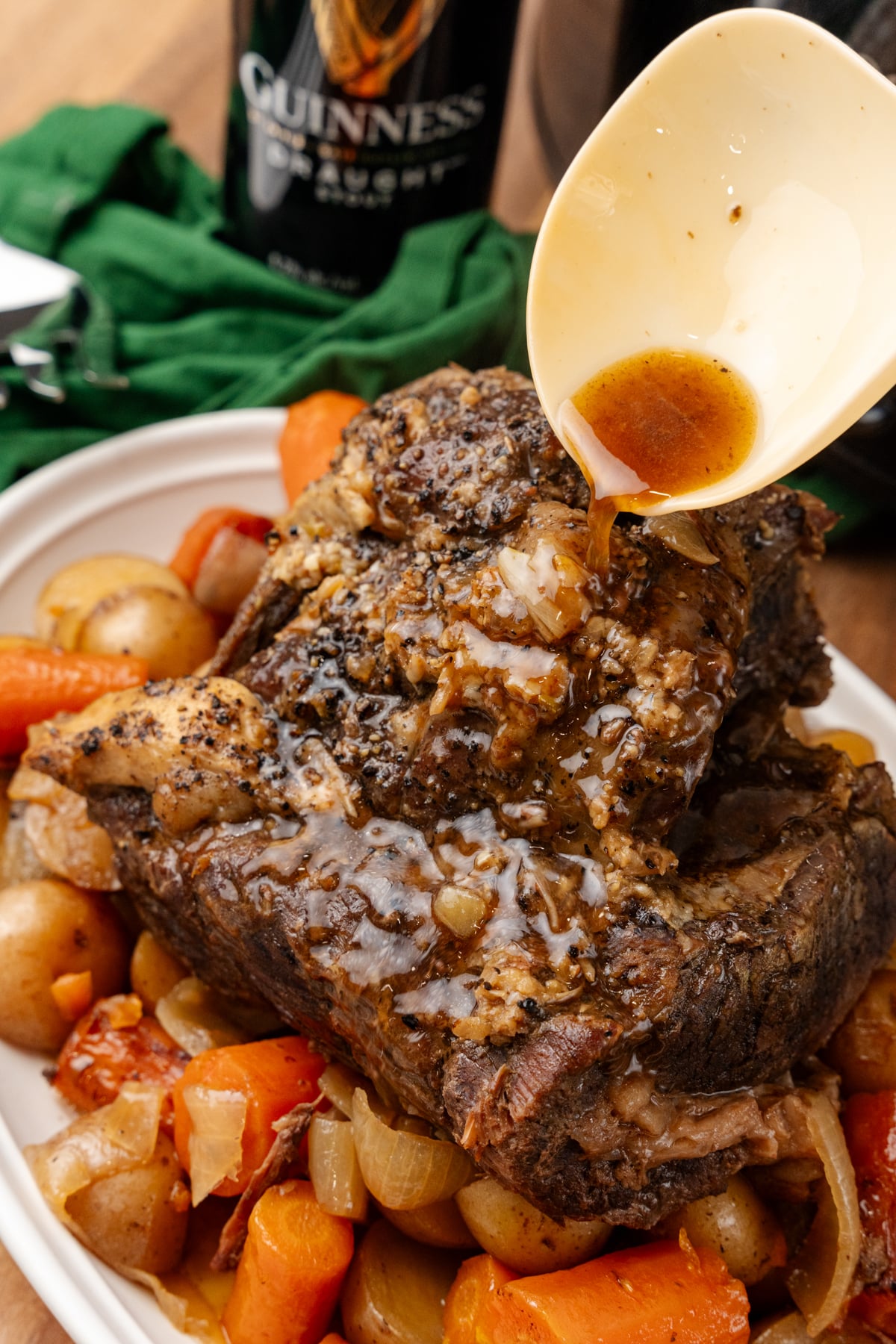 Overhead shot of the Irish pot roast in a white serving dish.