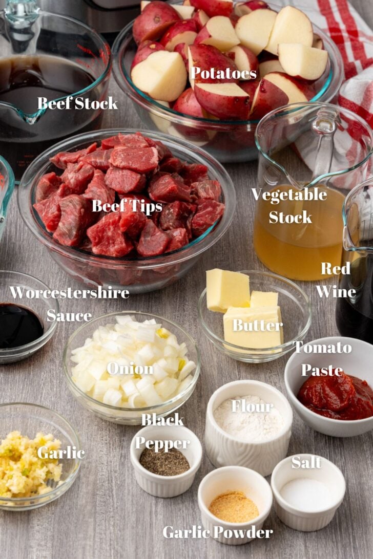 Beef stock, potatoes, beef tips, vegetable stock, red wine, worcestershire sause, butter, garlic, onions, tomato paste, salt, pepper, flour and garlic powder in glass containers for Shepherd's Pie.