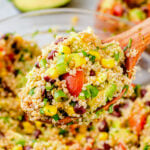 Mexican quinoa bowl with black beans, corn, tomatoes, and fresh cilantro, a healthy weeknight dinner.
