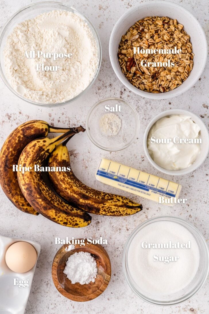 Bananas and ingredients for granola muffins in white or clear glass bowls.