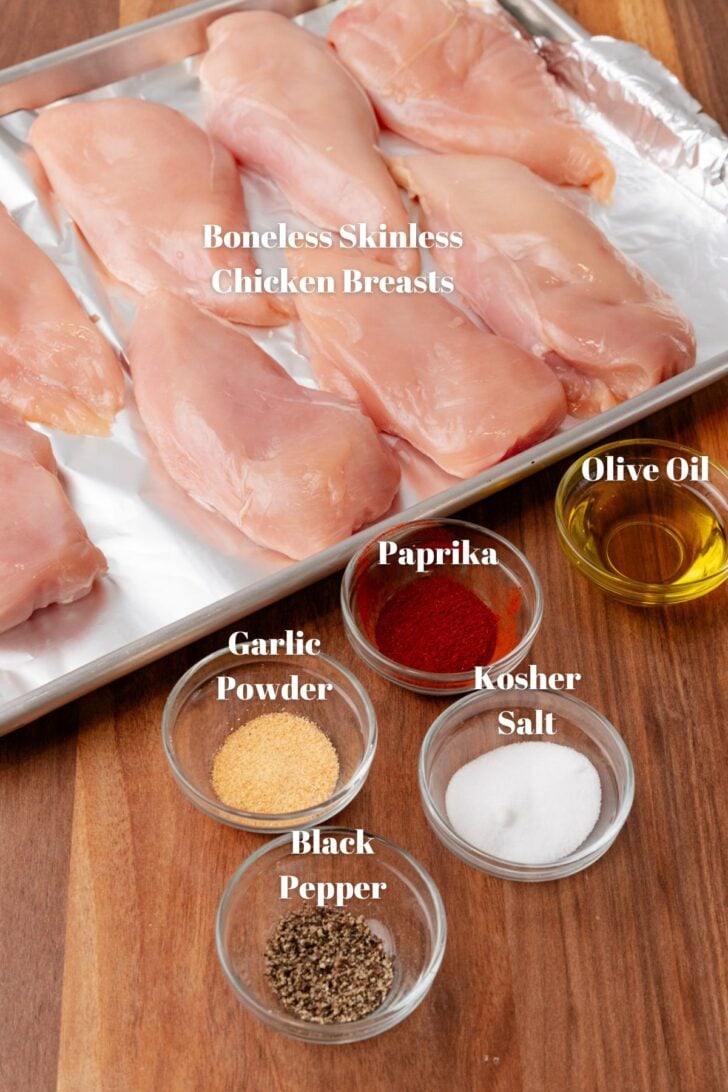 Ingredients for oven roasted chicken breasts with chicken, olive oil and seasoning.