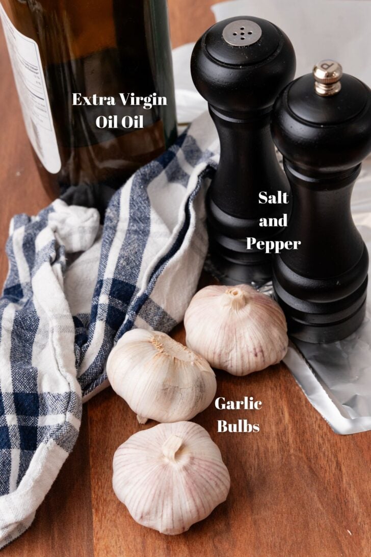 Ingredients for making roaasted garlic bulbs in the oven.