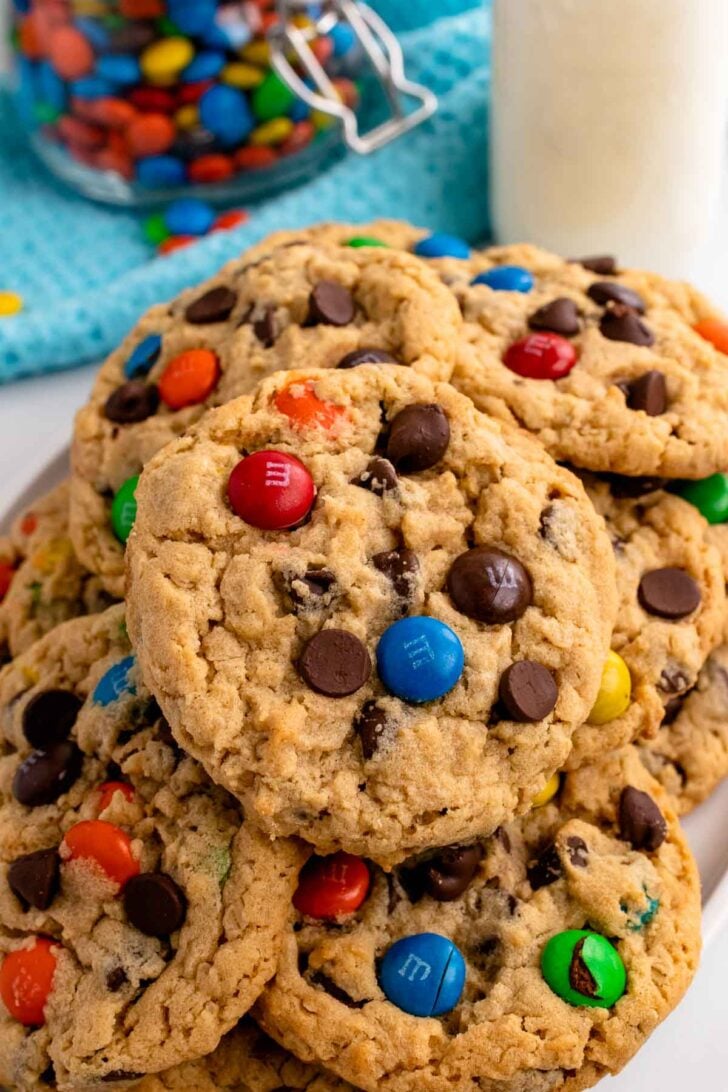 For a bakery-style cookie that's quick, easy, and flavorful, look no further than Monster Cookies! These delicious cookies feature a hint of peanut butter and chocolate chips, ensuring they're a hit with everyone. Plus, with the perfect ratio of M&Ms to dough, every bite is bursting with sweetness.