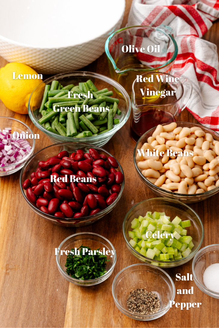 Ingredients for three bean salad in clear glass containers for easy prep and mixing.