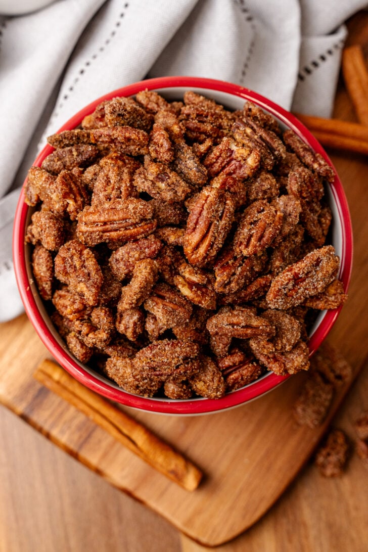 Bowl with a red rim of Southern candied pecans.