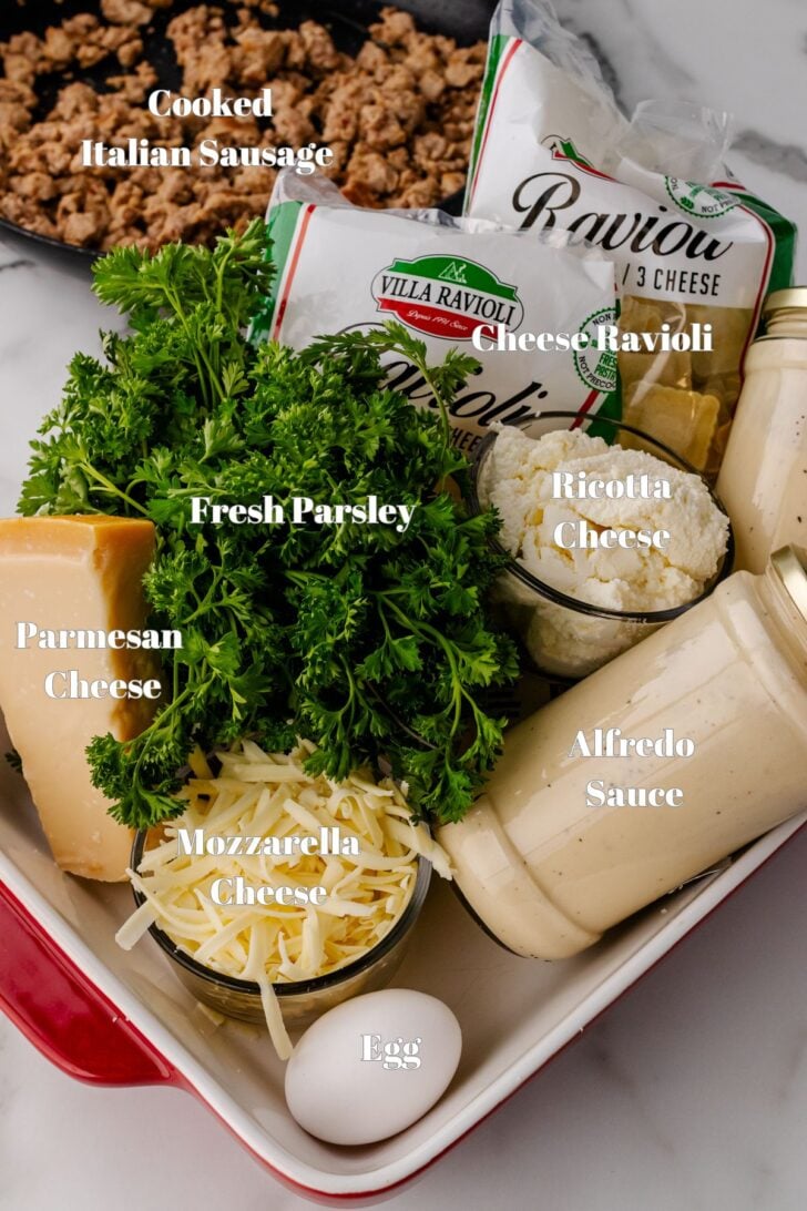 Ingredients for creamy white alfredo sauce lasagna with Italian sausage.