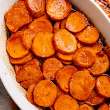 Candied Southern yams topped with marshmallows in a baking dish