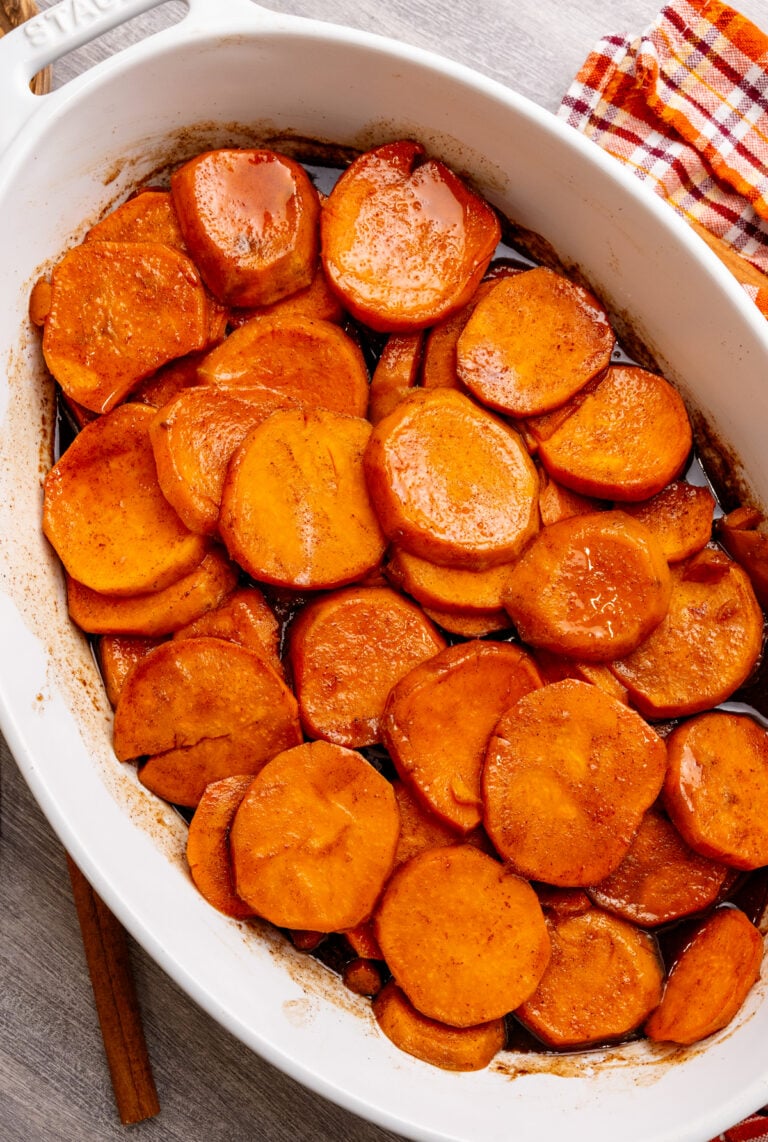 Candied Southern yams topped with marshmallows in a baking dish