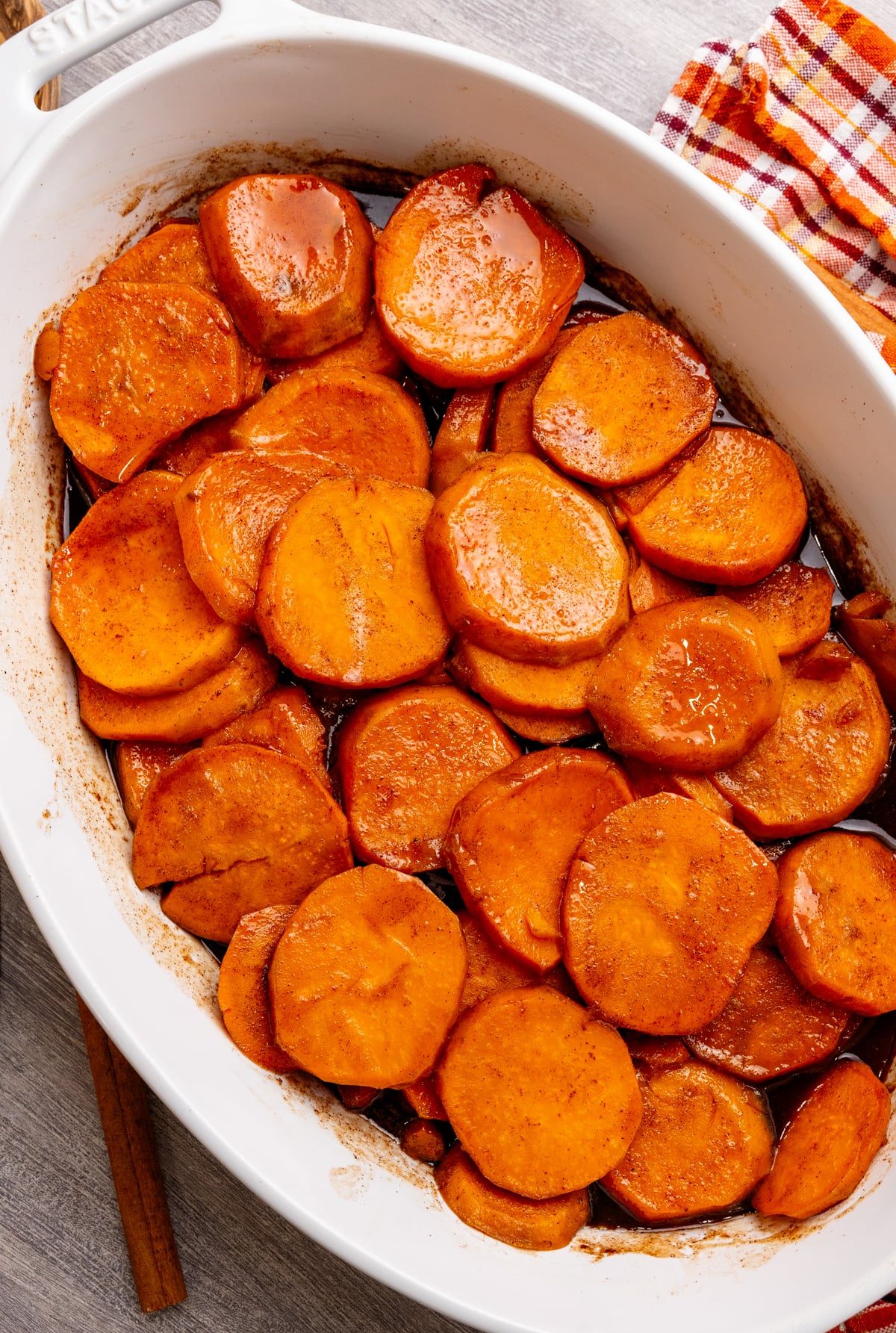 Candied Southern yams topped with marshmallows in a baking dish