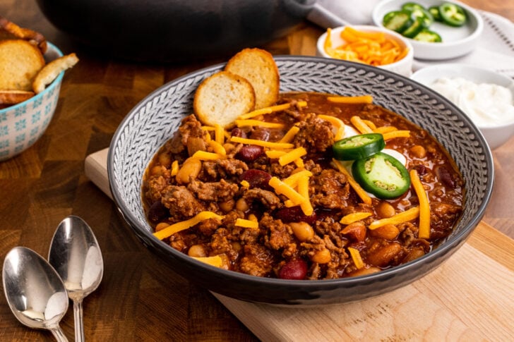 Bowl of Bloody Mary Chili served with sour cream and jalapenos for dinner.