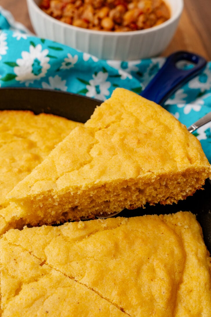 There's almost nothing more delicious or classic than Southern Cornbread in Cast Iron. What sets this cornbread recipe apart is a combination of stone-ground cornmeal and buttermilk. It's moist and buttery with a crispy golden edge, perfect for serving with fried chicken, chili, or a big bowl of soup.