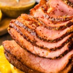 4-Ingredient crock pot ham sliced and ready for a weeknight meal or holiday celebration.