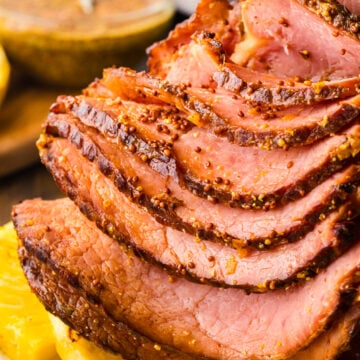 4-Ingredient crock pot ham sliced and ready for a weeknight meal or holiday celebration.