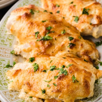 Juicy melt-in-your-mouth baked chicken breast on a plate