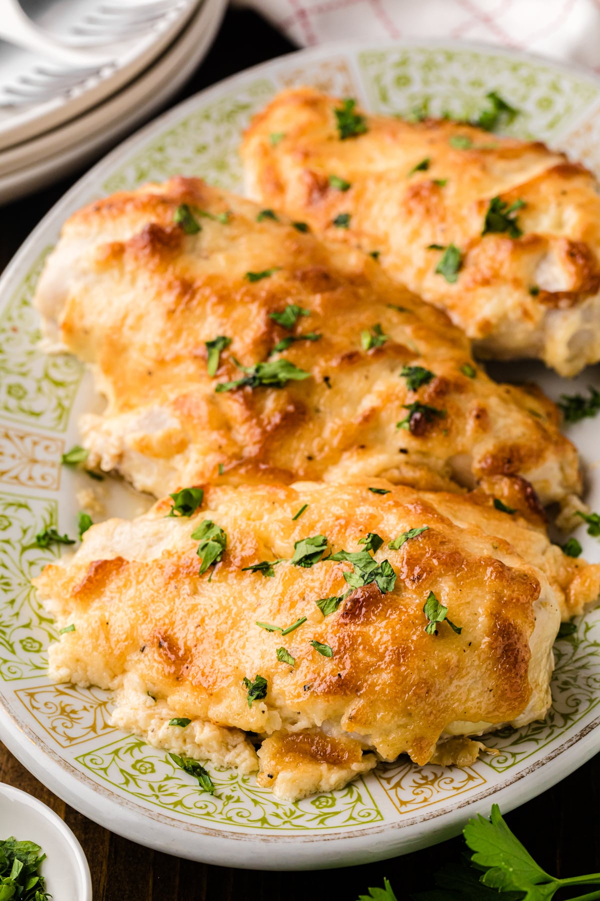 Juicy melt-in-your-mouth baked chicken breast on a plate