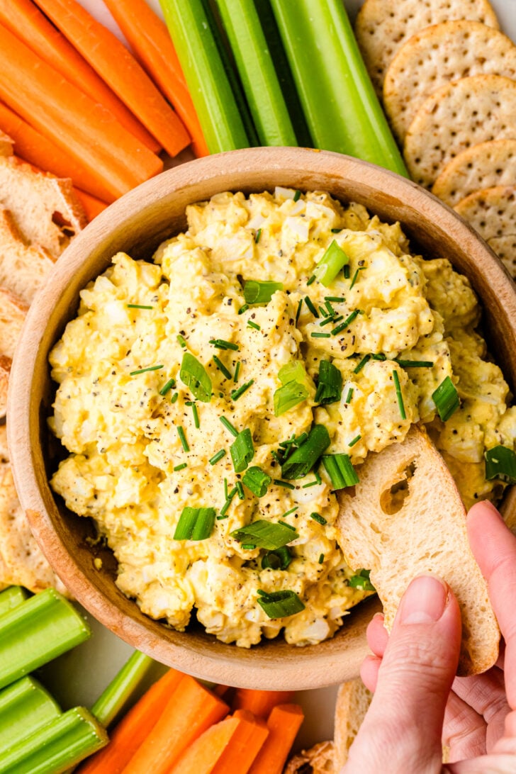 Deviled Egg Dip served with toast, carrot sticks and celery.