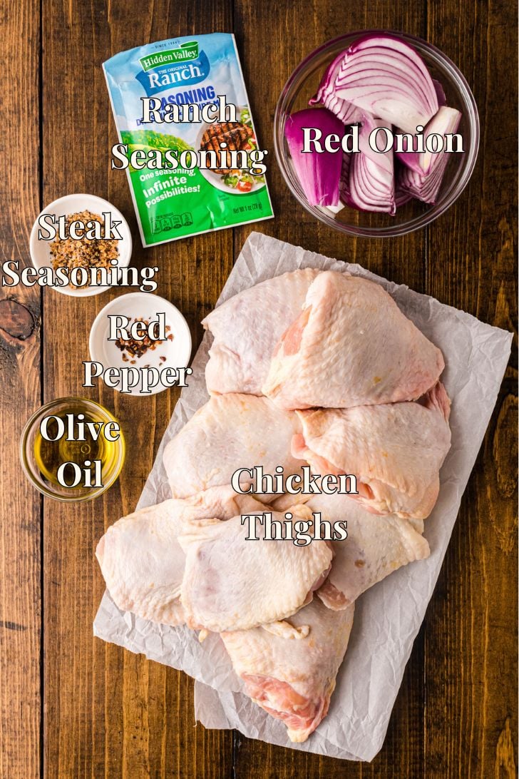 Ingredients including ranch seasoning mix and red onions for sheet pan bone-in skin on shicken thights.