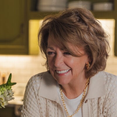 Donya Mullins, creator of A Southern Soul food blog, smiling in her kitchen.
