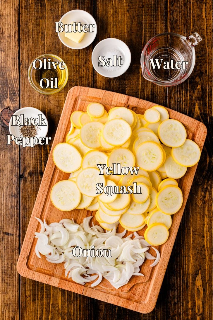 http://asouthern-soul.blogspot.com A wooden cutting board filled with sliced yellow squash and onions is surrounded by small bowls containing black pepper, salt, butter, olive oil, and a glass measuring cup of water. Each ingredient is labeled with bold text, all placed on a rustic wood surface.