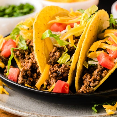 Seasoned crockpot taco meat in a slow cooker, perfectly spiced ground beef ready for tacos, burritos, and nachos.