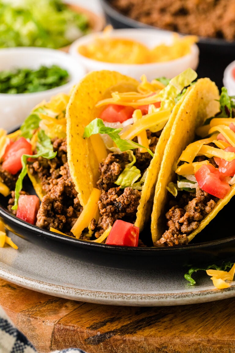 Seasoned crockpot taco meat in a slow cooker, perfectly spiced ground beef ready for tacos, burritos, and nachos.