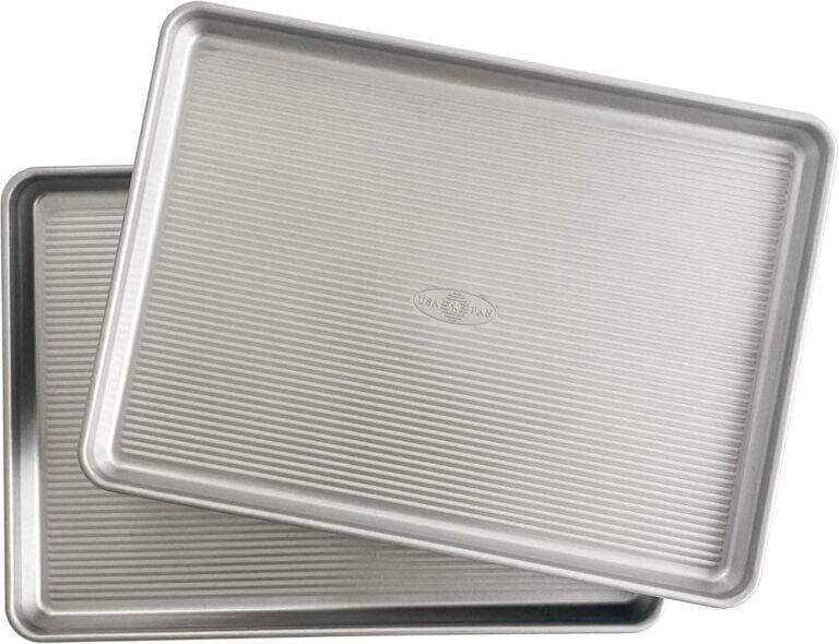 Two silver USA brand sheet pans stacked at an angle, showing ribbed cooking surfaces for My Favorite Sheet Pan Recipes: Easy Dinners with Bi