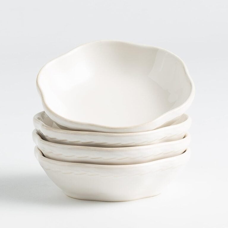 Stack of stoneware small bowls with an organic, uneven shape.